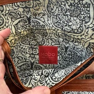 HOBO Brown Leather Trifold wallet with Black & Cream Floral Lining